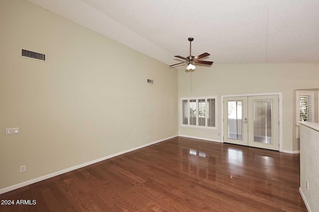 unfurnished living room featuring ceiling fan, french doors, high vaulted ceiling, dark hardwood / wood-style floors, and a textured ceiling