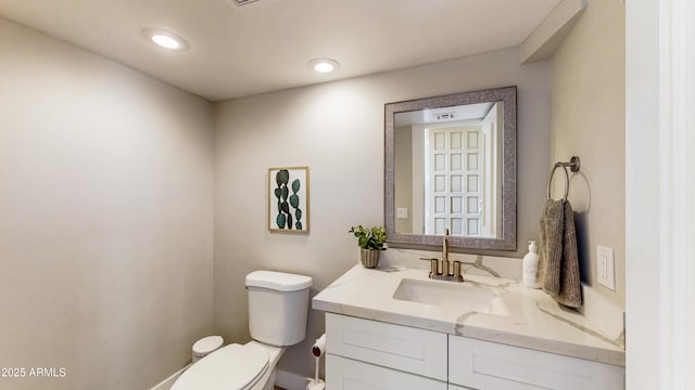 25555 N Windy Walk Dr Unit 64, Scottsdale, AZ 85255 - bathroom with toilet, vanity, and recessed lighting