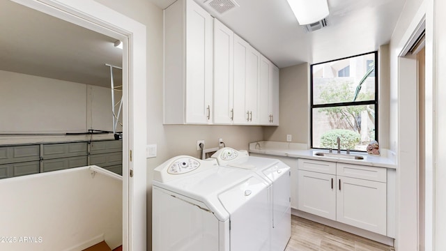 25555 N Windy Walk Dr Unit 64, Scottsdale, AZ 85255 - laundry room featuring cabinet space, separate washer and dryer, and light wood finished floors