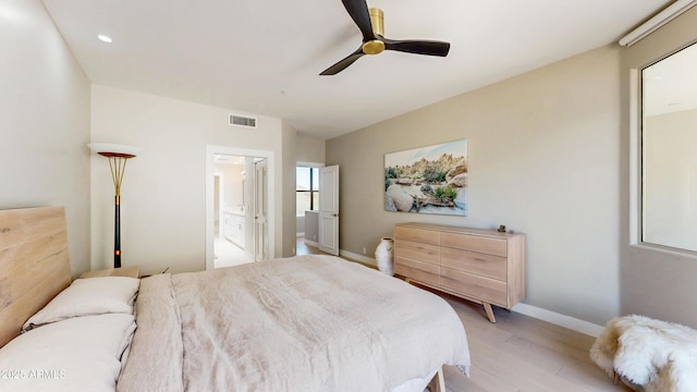 25555 N Windy Walk Dr Unit 64, Scottsdale, AZ 85255 - bedroom featuring light wood-type flooring, baseboards, ensuite bath, ceiling fan, and recessed lighting