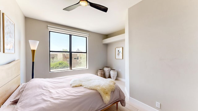 25555 N Windy Walk Dr Unit 64, Scottsdale, AZ 85255 - bedroom featuring a ceiling fan and baseboards