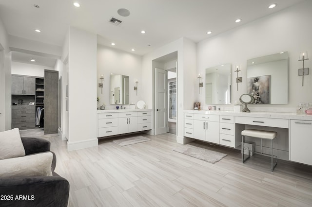 bathroom with vanity and wood-type flooring