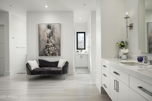 bathroom featuring vanity and wood-type flooring