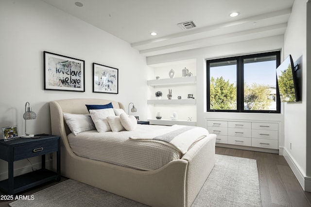 bedroom featuring dark hardwood / wood-style flooring