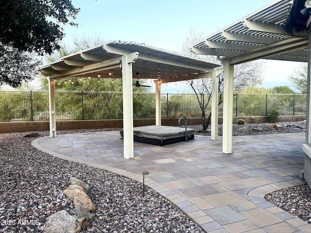 view of patio featuring a pergola and a hot tub