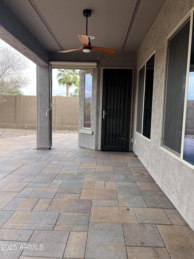 view of patio / terrace featuring ceiling fan