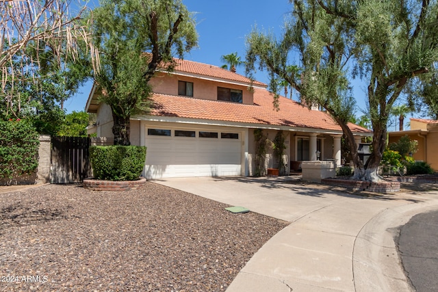 mediterranean / spanish house featuring a garage