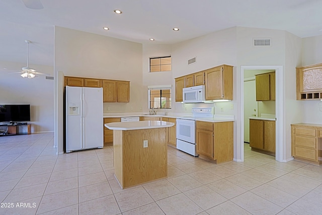 3928 N 151st Ave, Goodyear, AZ 85395 - kitchen with visible vents, light countertops, a high ceiling, and white appliances