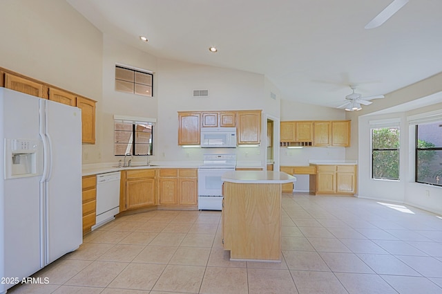 3928 N 151st Ave, Goodyear, AZ 85395 - kitchen with light brown cabinetry, light tile patterned flooring, a sink, white appliances, and a ceiling fan