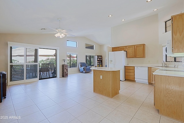 3928 N 151st Ave, Goodyear, AZ 85395 - kitchen featuring white appliances, open floor plan, a center island, a ceiling fan, and light tile patterned floors