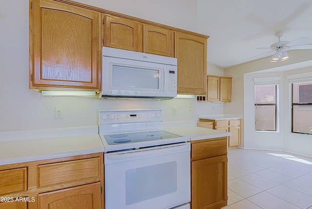 3928 N 151st Ave, Goodyear, AZ 85395 - kitchen with light countertops, light tile patterned floors, a ceiling fan, and white appliances