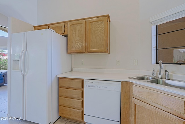 3928 N 151st Ave, Goodyear, AZ 85395 - kitchen with light brown cabinetry, light tile patterned flooring, white appliances, light countertops, and a sink