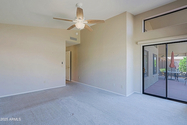 3928 N 151st Ave, Goodyear, AZ 85395 - empty room with carpet floors, a ceiling fan, baseboards, lofted ceiling, and visible vents