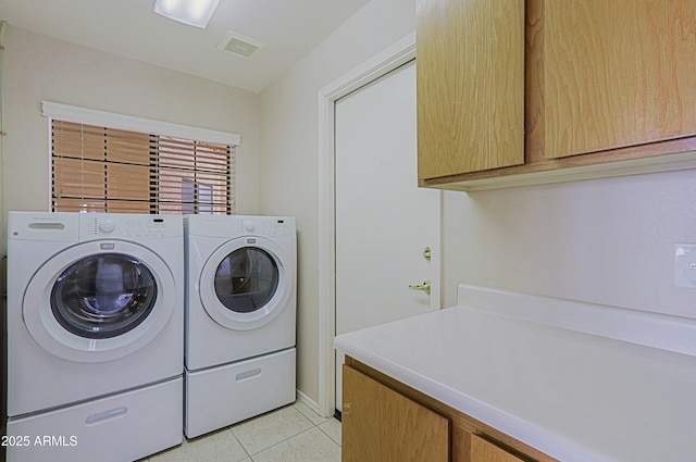 3928 N 151st Ave, Goodyear, AZ 85395 - clothes washing area featuring cabinet space, light tile patterned floors, visible vents, and washer and clothes dryer