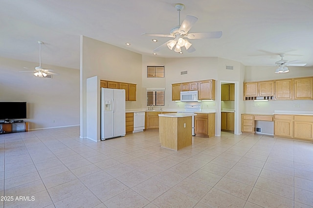 3928 N 151st Ave, Goodyear, AZ 85395 - kitchen featuring white appliances, open floor plan, ceiling fan, high vaulted ceiling, and a sink