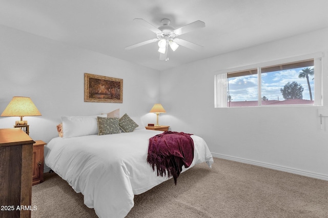 carpeted bedroom featuring a ceiling fan and baseboards