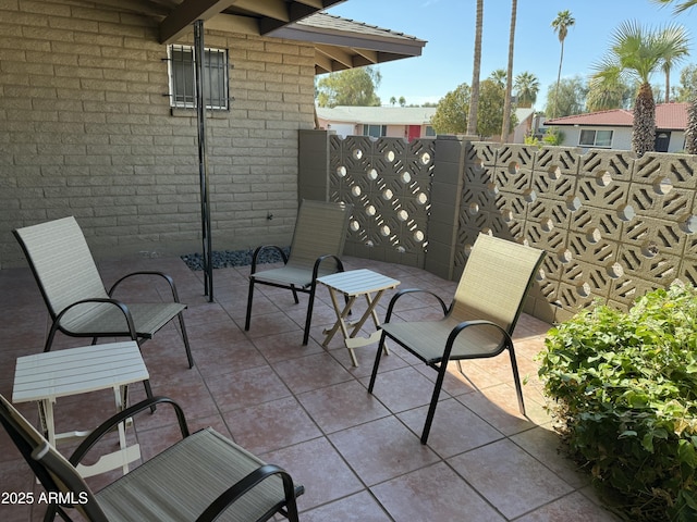 view of patio / terrace featuring fence