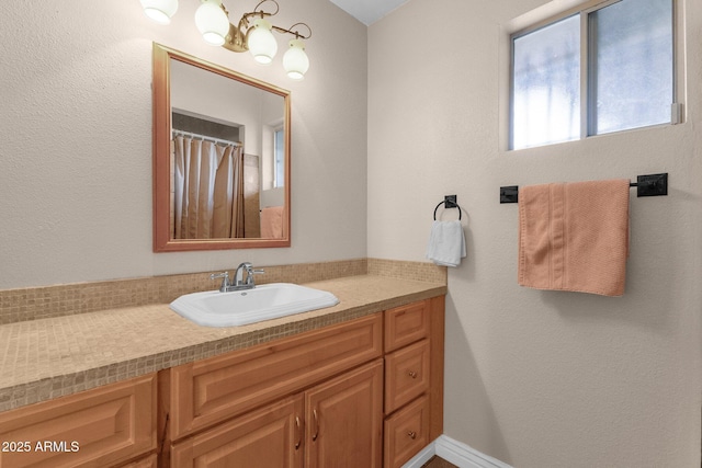 bathroom featuring vanity and a shower with curtain