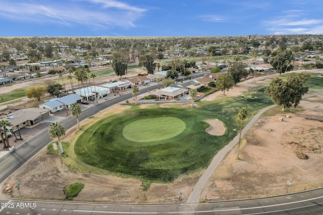 birds eye view of property featuring view of golf course and a residential view