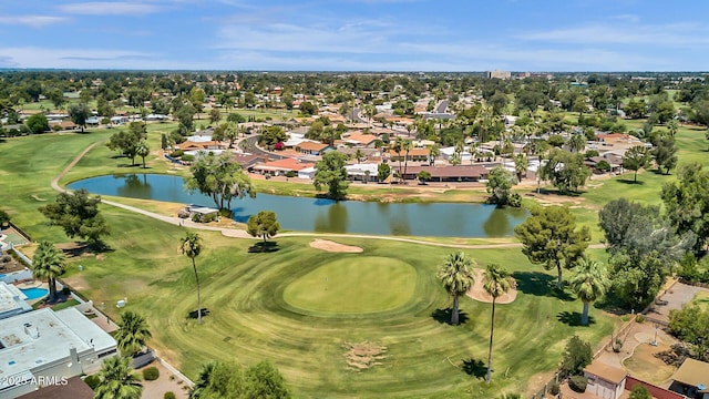 aerial view with view of golf course, a water view, and a residential view