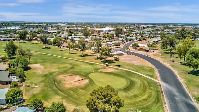 drone / aerial view with golf course view and a residential view