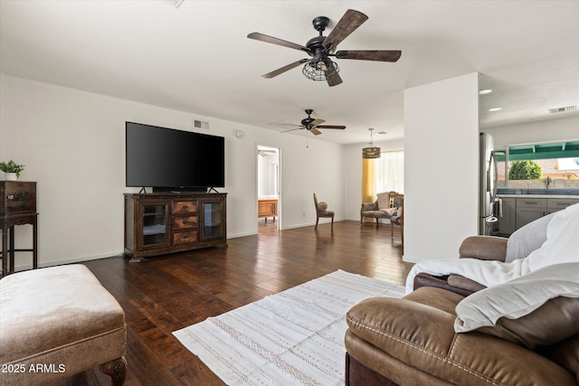 living room with dark hardwood / wood-style flooring