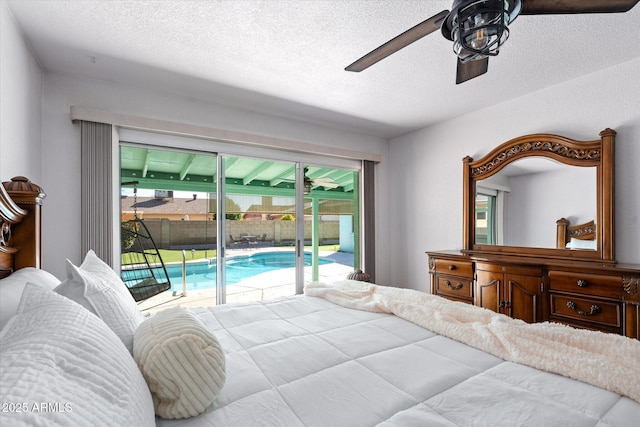 bedroom featuring ceiling fan, a textured ceiling, and access to outside