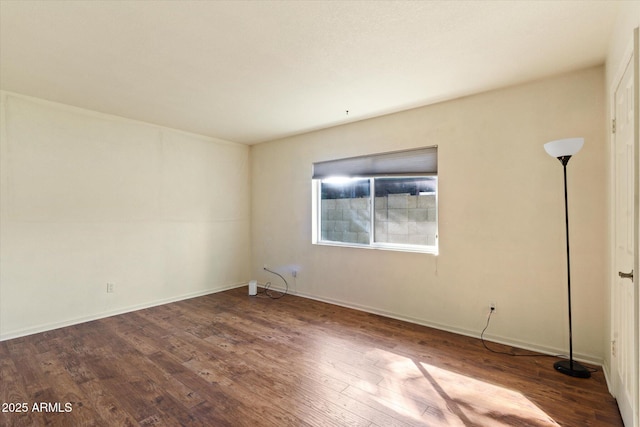 unfurnished room with hardwood / wood-style floors