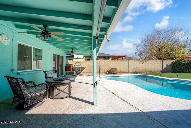 view of pool featuring ceiling fan and a patio area