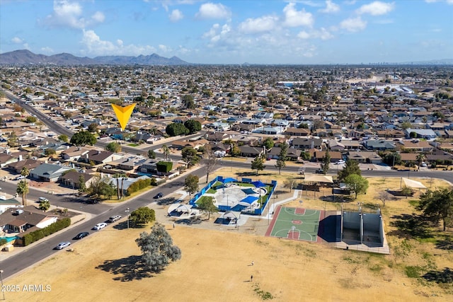 birds eye view of property featuring a mountain view