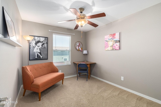 sitting room featuring carpet floors and ceiling fan