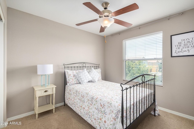 bedroom with ceiling fan and carpet flooring