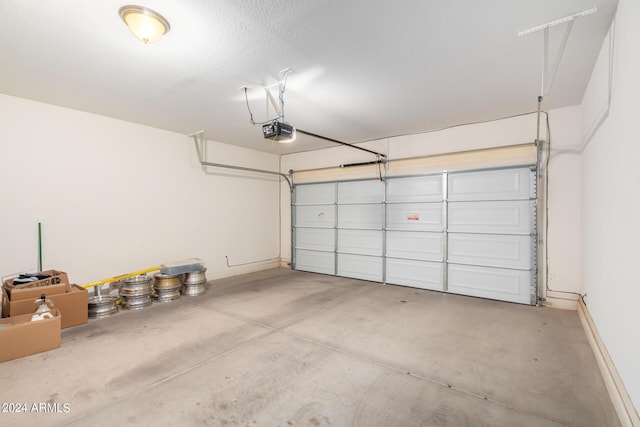 garage featuring a garage door opener