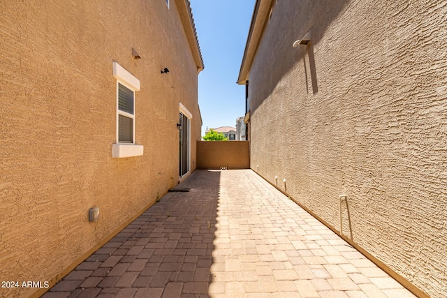 view of side of home featuring a patio