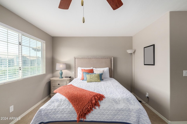 carpeted bedroom featuring ceiling fan