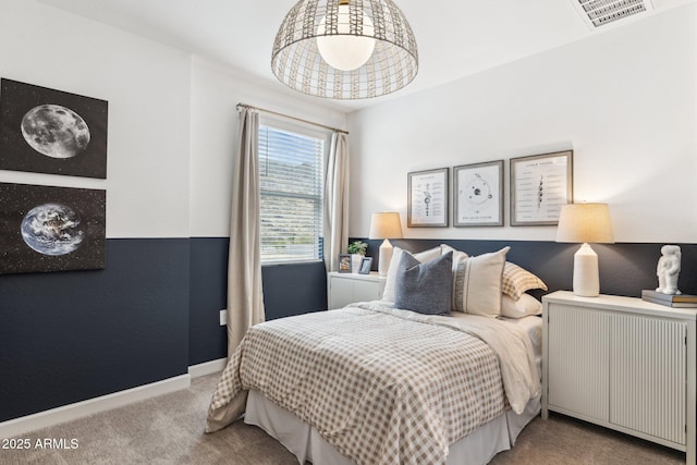 carpeted bedroom with radiator, visible vents, and baseboards