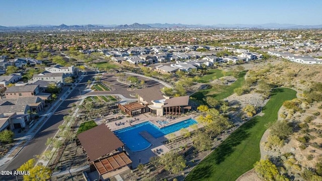 drone / aerial view featuring a residential view and a mountain view