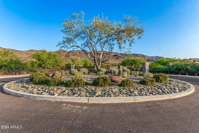 exterior space with fence and a mountain view