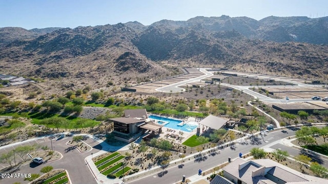 birds eye view of property with a mountain view