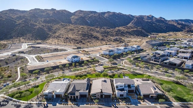 birds eye view of property with a mountain view and a residential view