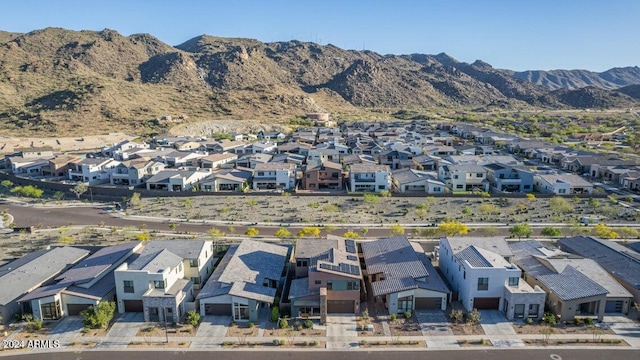 drone / aerial view featuring a residential view and a mountain view