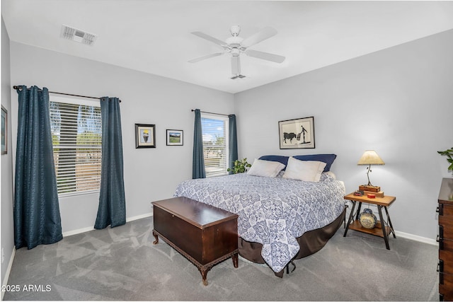 bedroom with carpet flooring, baseboards, visible vents, and ceiling fan