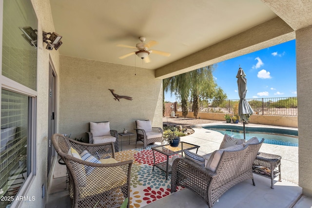view of patio featuring ceiling fan, outdoor lounge area, a fenced backyard, and a fenced in pool