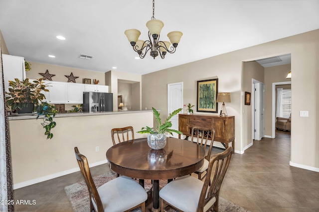 dining space featuring visible vents, recessed lighting, baseboards, and an inviting chandelier