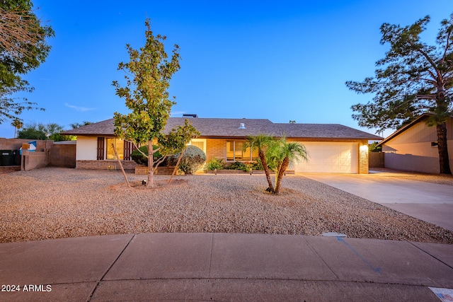 ranch-style home featuring a garage