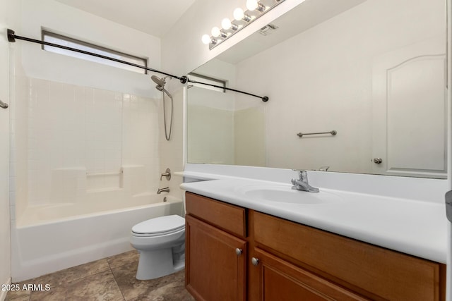 full bathroom featuring vanity, washtub / shower combination, and toilet