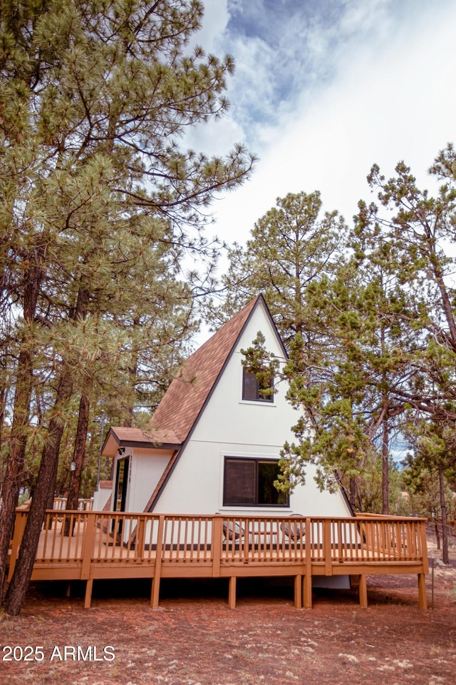 2124 Forest Park Dr, Overgaard, AZ 85933 - back of property with a shingled roof and a deck