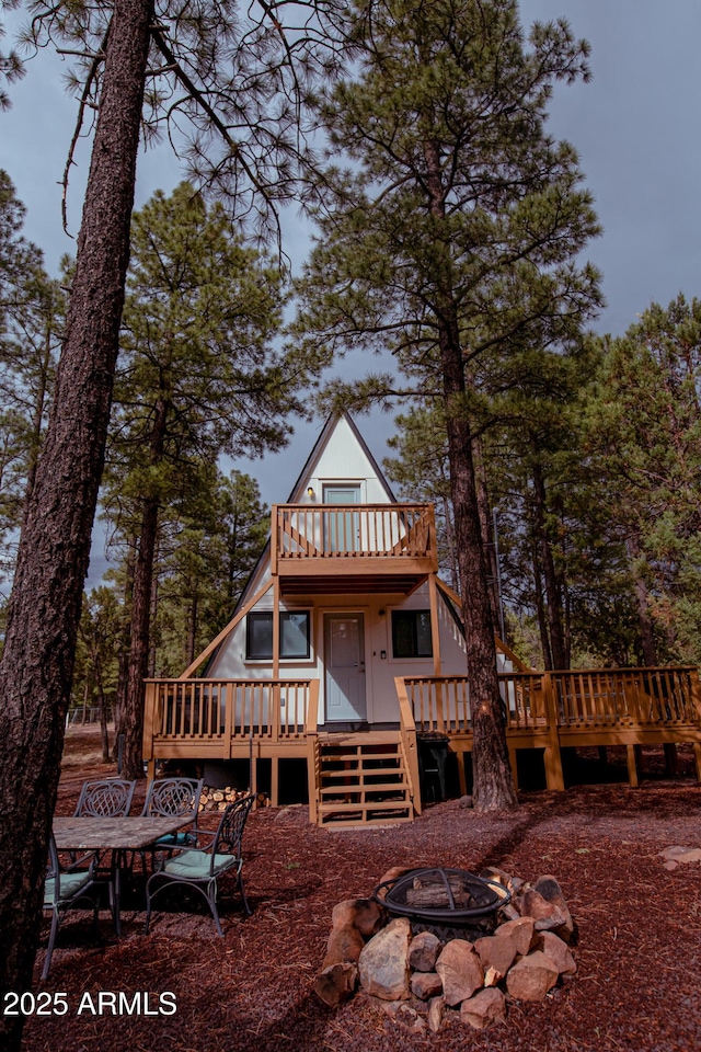 2124 Forest Park Dr, Overgaard, AZ 85933 - exterior space featuring an outdoor fire pit and a deck