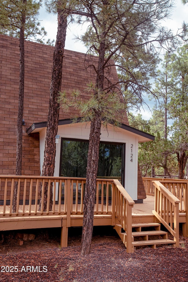2124 Forest Park Dr, Overgaard, AZ 85933 - back of property featuring a shingled roof and a deck