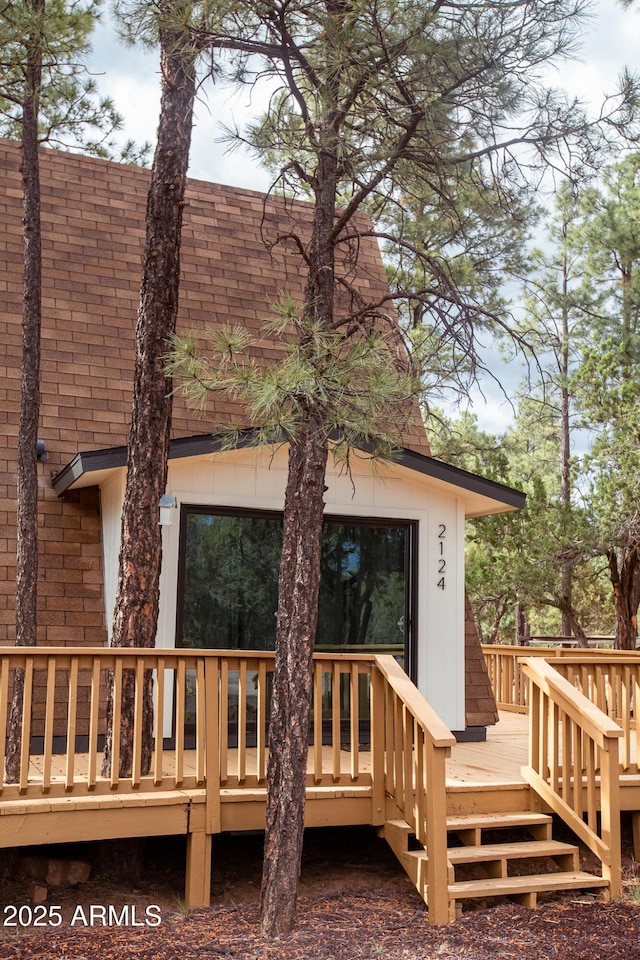 2124 Forest Park Dr, Overgaard, AZ 85933 - rear view of house featuring roof with shingles and a wooden deck